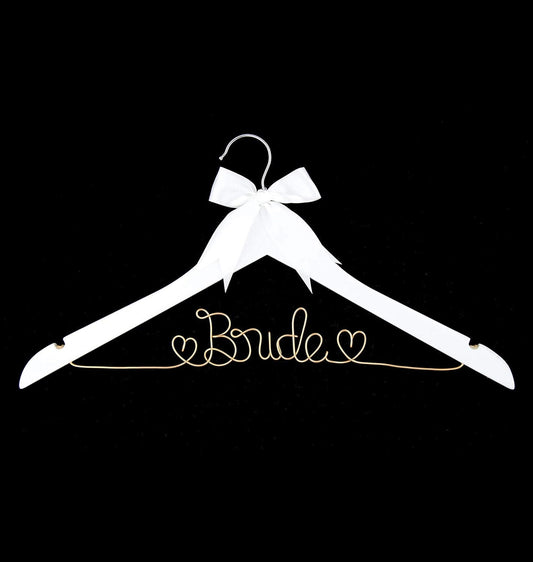 White hanger with 'Bride' text and a bow on a black background