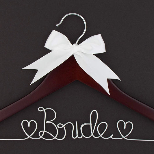 Maroon hanger with white bow and 'Bride' text on a dark background