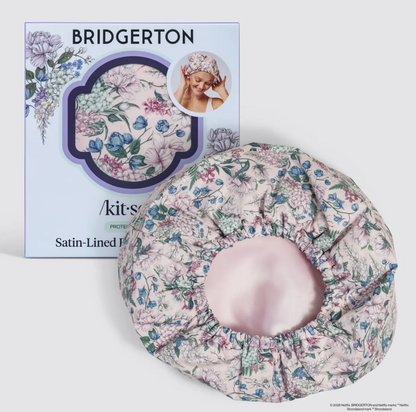 Floral satin-lined pillowcase with packaging featuring 'Bridgerton' branding on a white background. by Kitsch