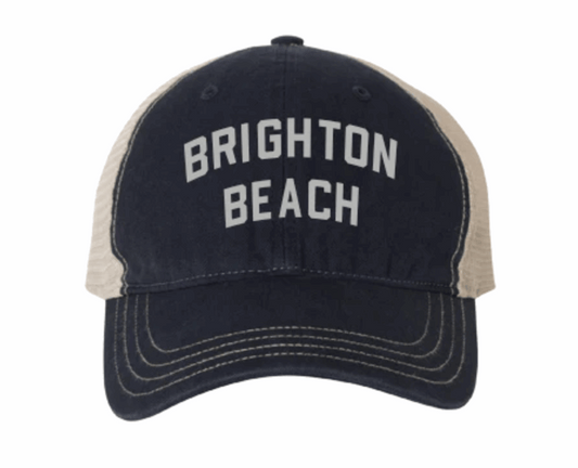 Navy and beige cap with 'Brighton Beach' text on a white background