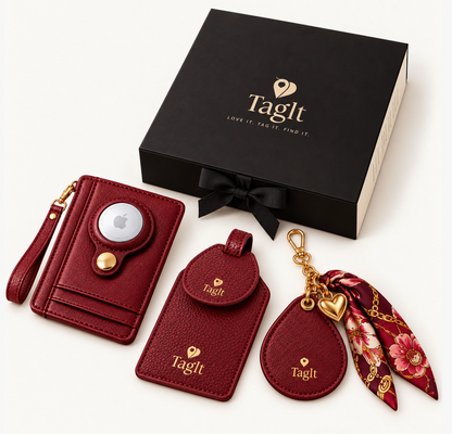 Burgundy wallet, luggage tag, and floral scarf keychain displayed with a black signature gift box.