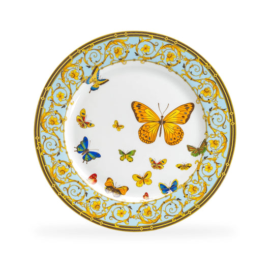 Decorative plate with butterfly designs and gold embellishments on a white background