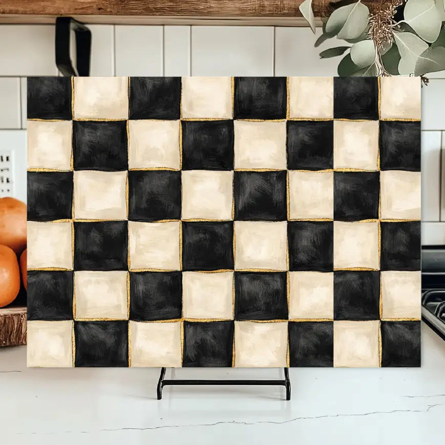 Checkered fabric panel in a kitchen setting with oranges and a plant.