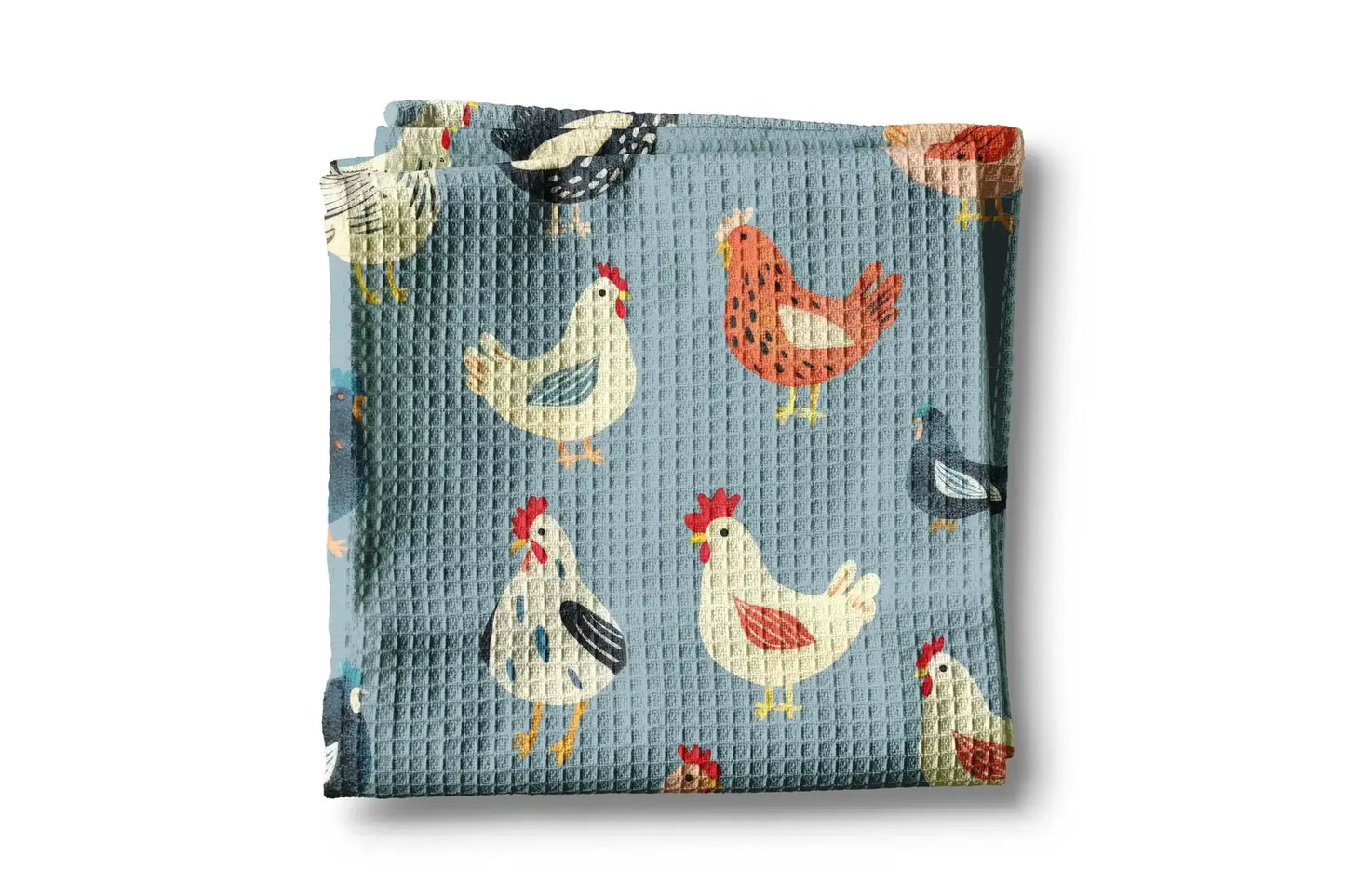 Folded fabric with chicken pattern on a blue background