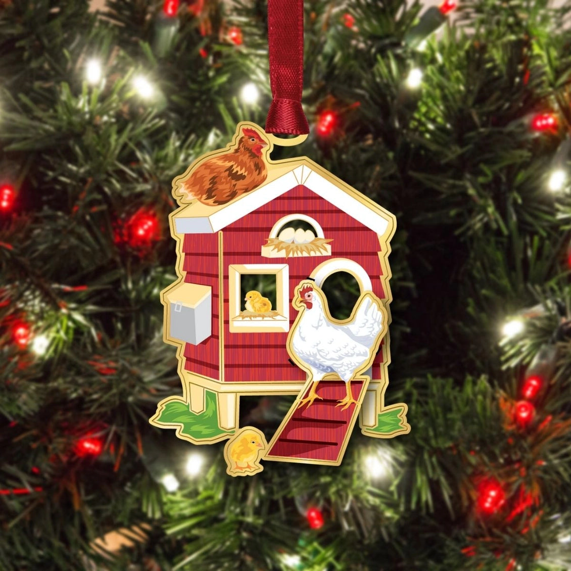Decorative ornament of a red chicken coop with a rooster on a Christmas tree.