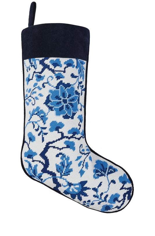 Christmas stocking with blue floral pattern on a white background