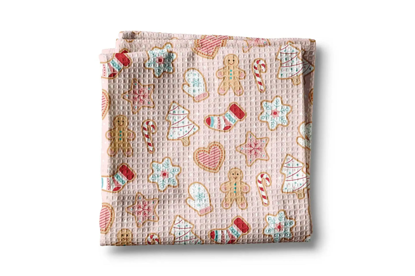 Folded fabric with Christmas-themed cookies pattern on a white background