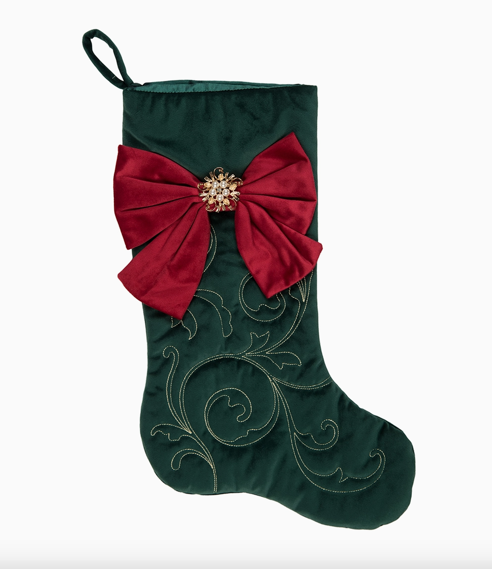 Deep green Christmas stocking with oversized red bow, jeweled pearl center and gold embroidered scrollwork