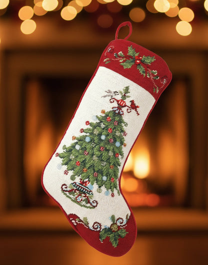 Decorative Christmas stocking with a embroidered tree design on a white background