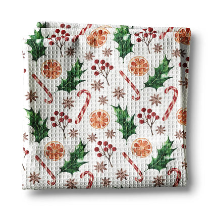 Waffle-textured towel with Christmas-themed pattern on a white background