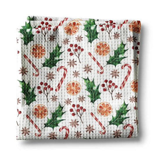 Waffle-textured towel with Christmas-themed pattern on a white background