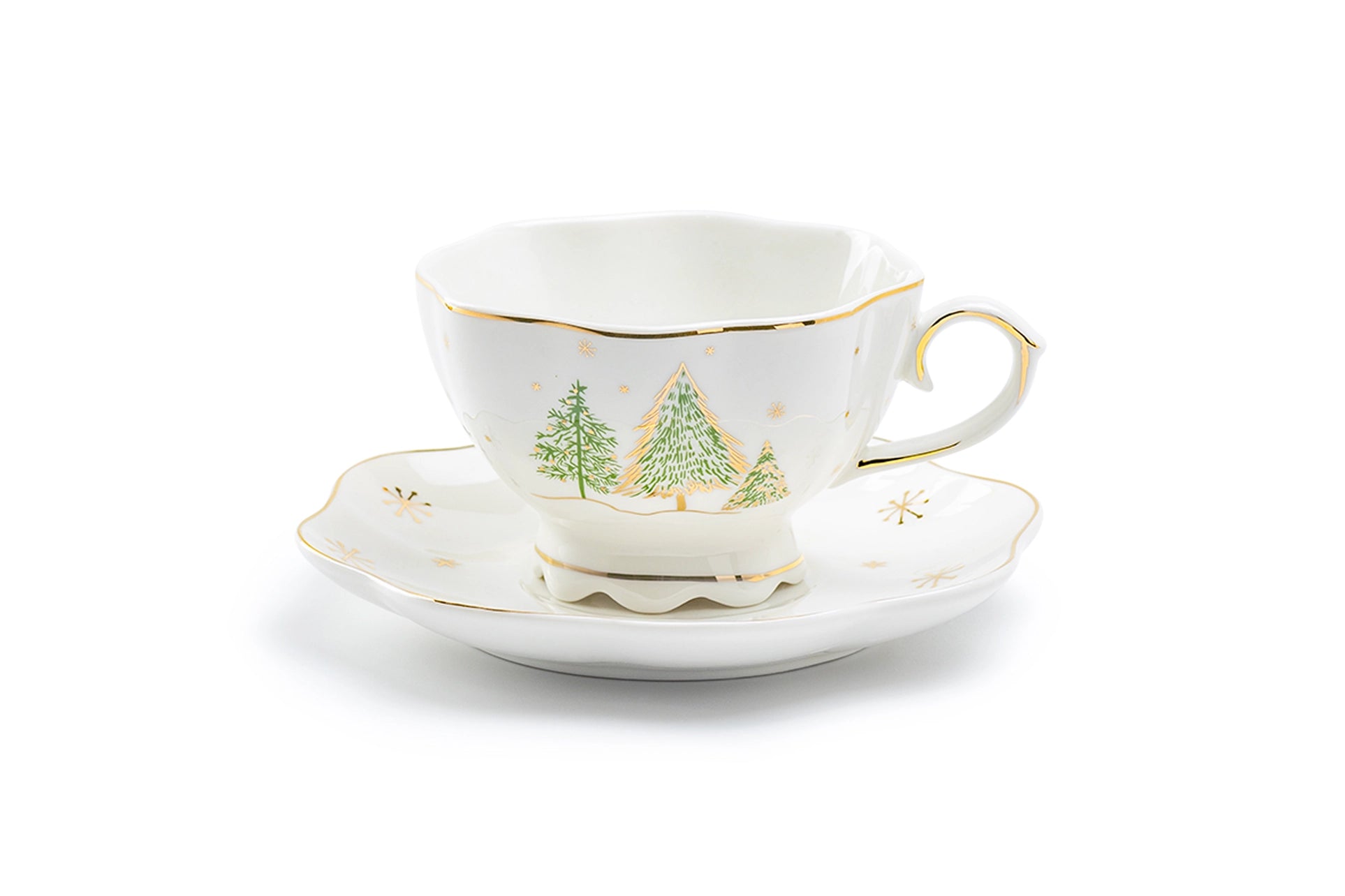Teacup and saucer with Christmas tree design on a white background