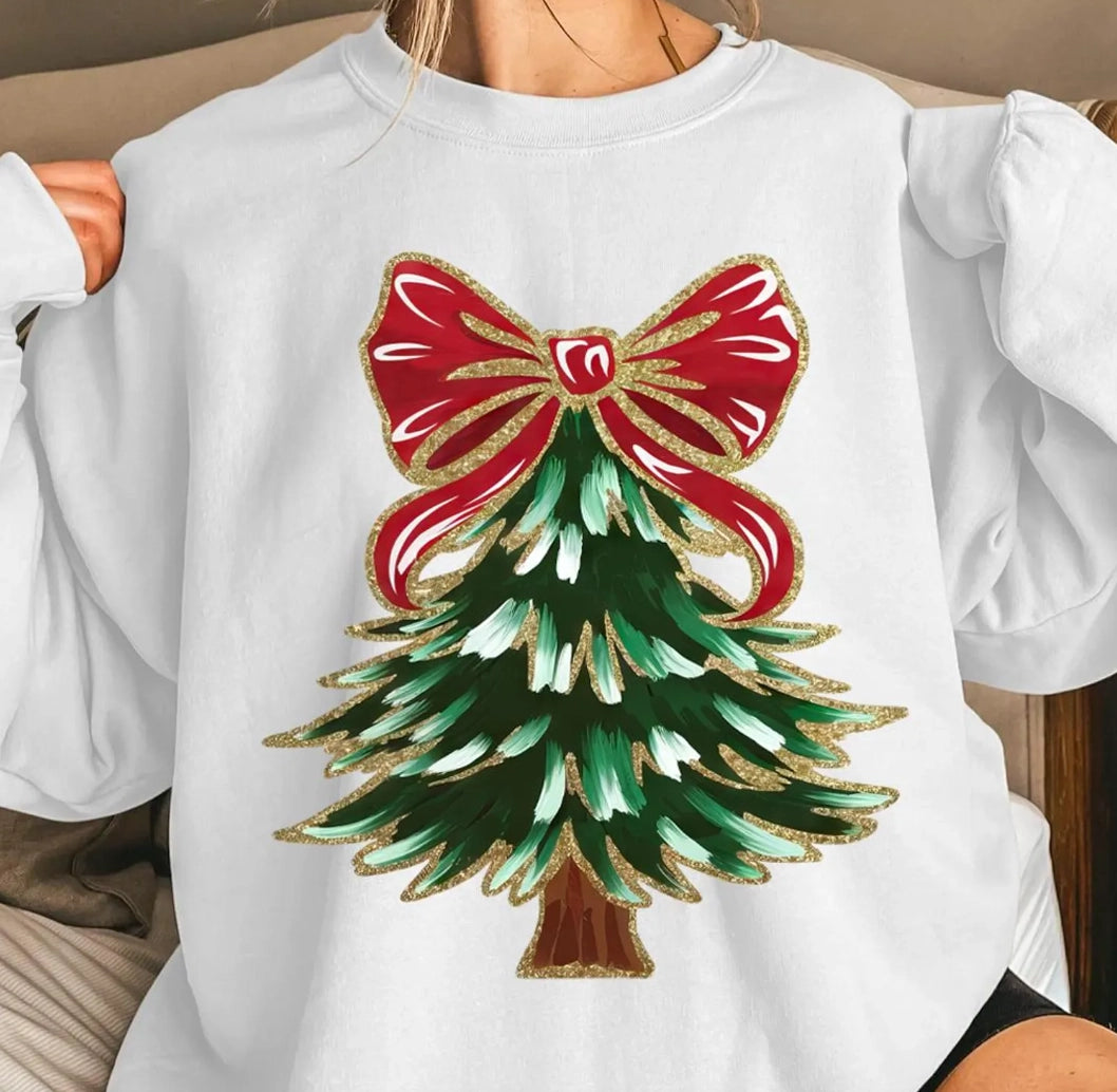 White sweatshirt with a Christmas tree and red bow design.