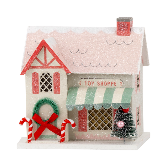 Decorative toy shoppe with candy canes and a Christmas tree on a white background
