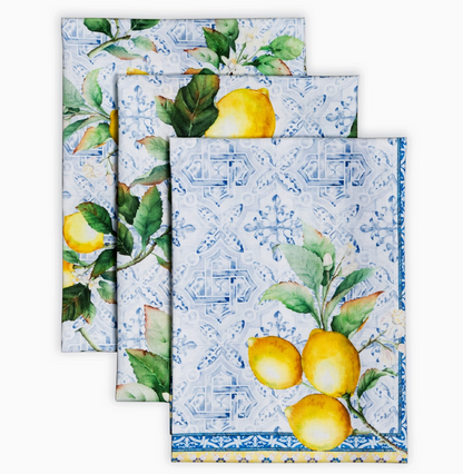 Set of three decorative towels with lemon and tile pattern on a white background