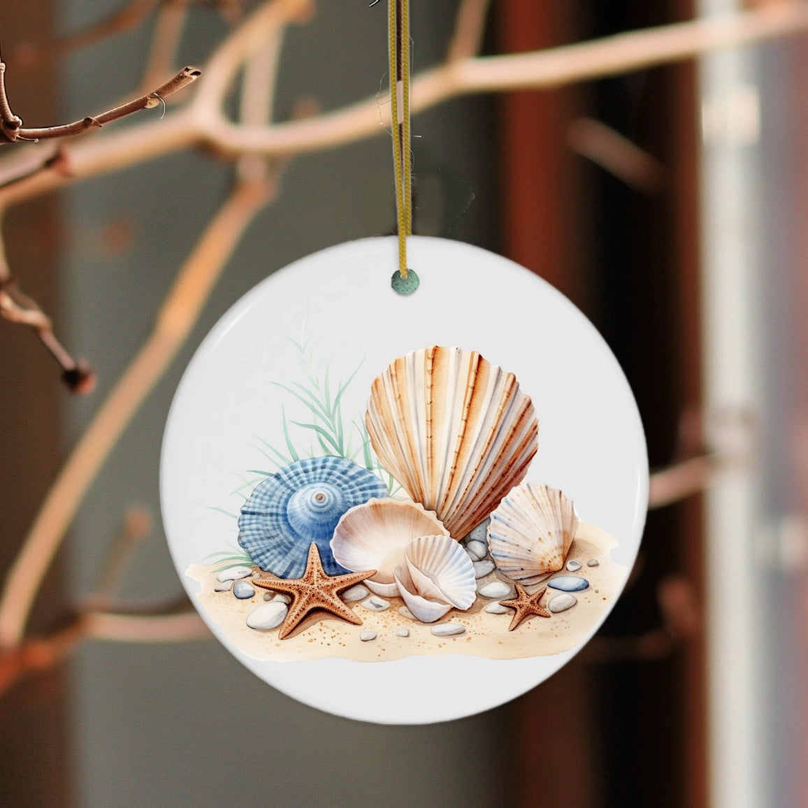 Round decorative ornament with seashells and starfish on a branch