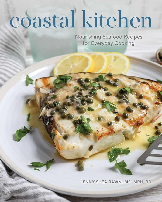 Book cover of 'Coastal Kitchen' with a dish of fish on a plate.
