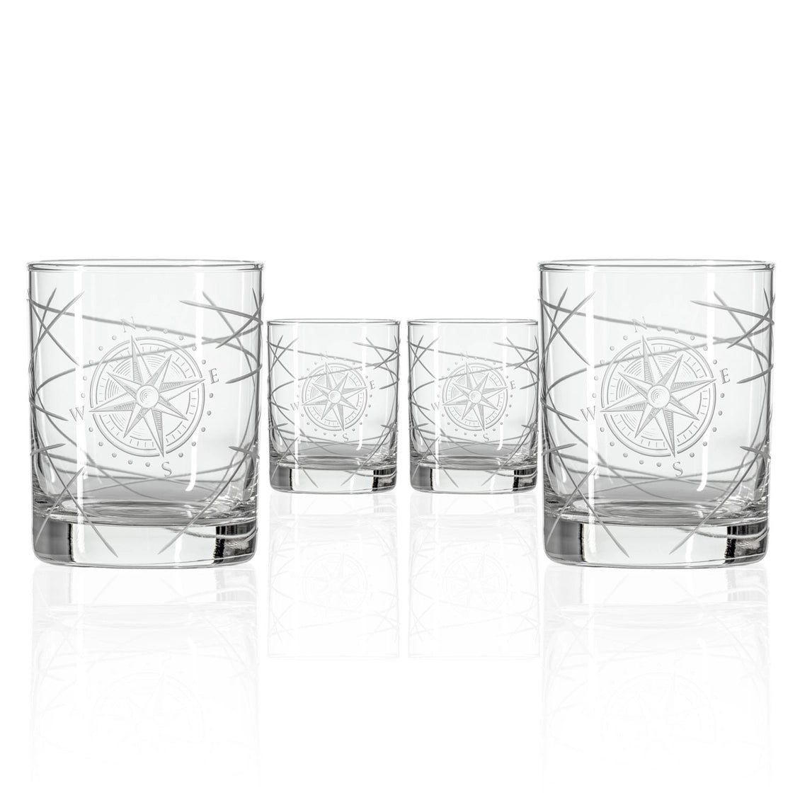 Set of four clear glass tumblers with starfish design on a white background