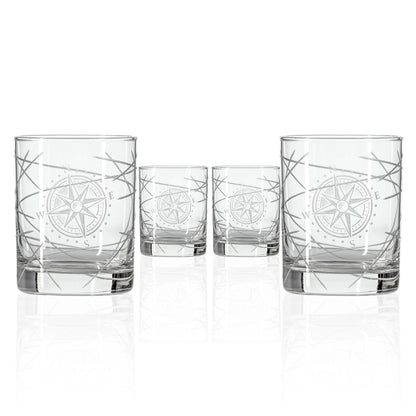 Set of four clear glass tumblers with starfish design on a white background