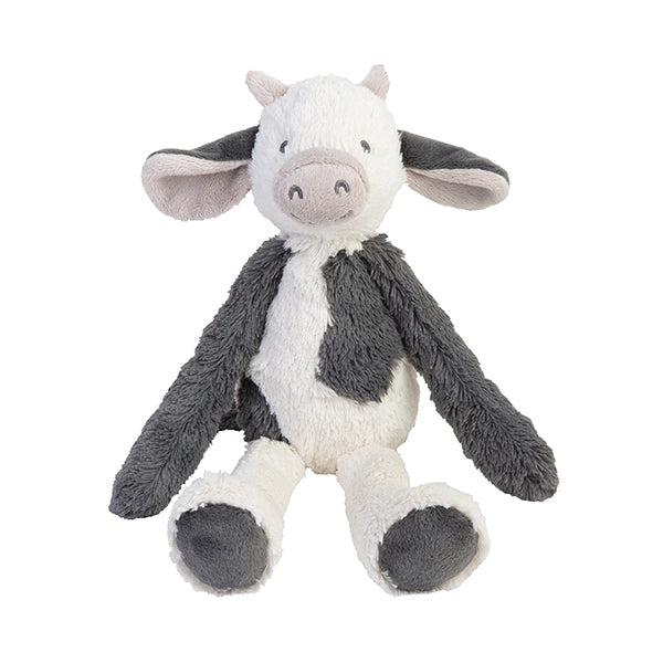 Plush cow toy with gray and white color pattern on a white background