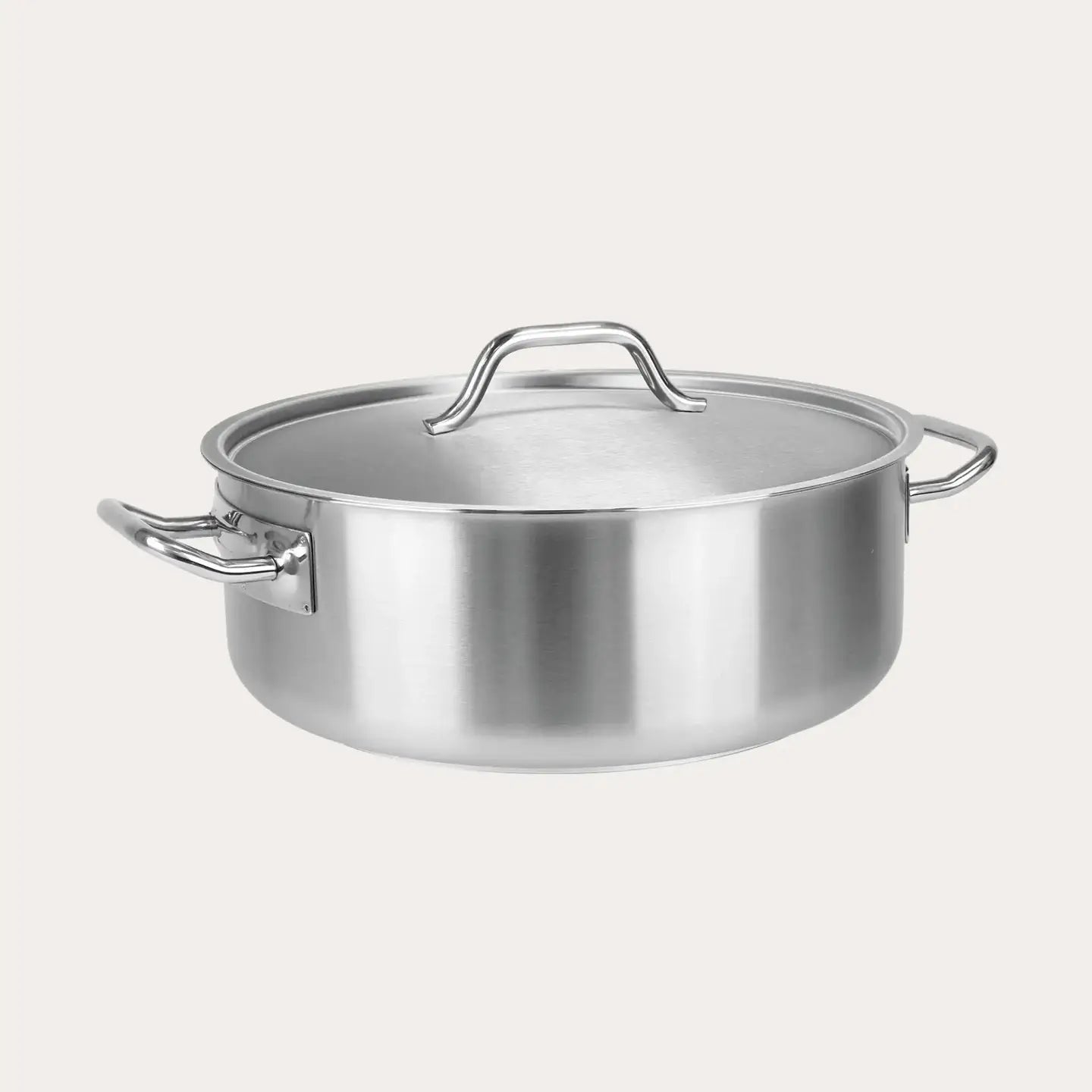 Stainless steel pot with lid on a white background