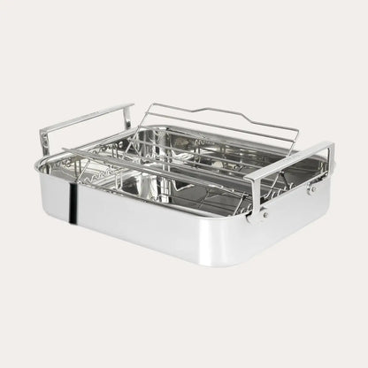 Stainless steel roasting pan with rack on a white background