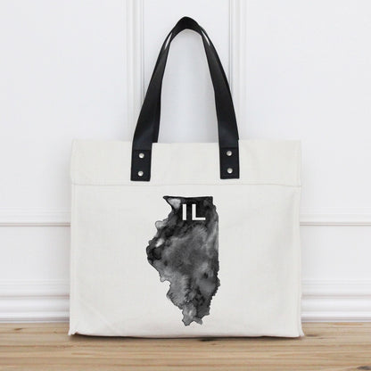Tote bag with black handle and Illinois state outline design on a white background