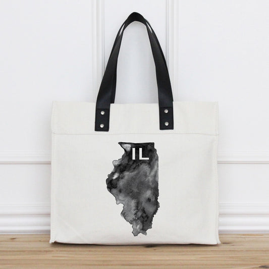Tote bag with black handle and Illinois state outline design on a white background