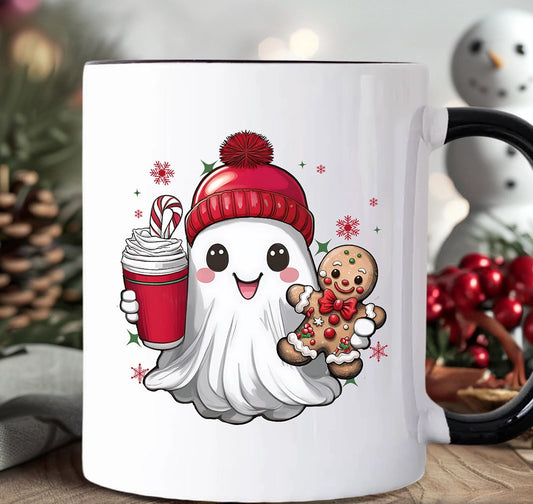 White mug with a cartoon ghost character holding a gingerbread man and a hot chocolate, set against a festive background.
