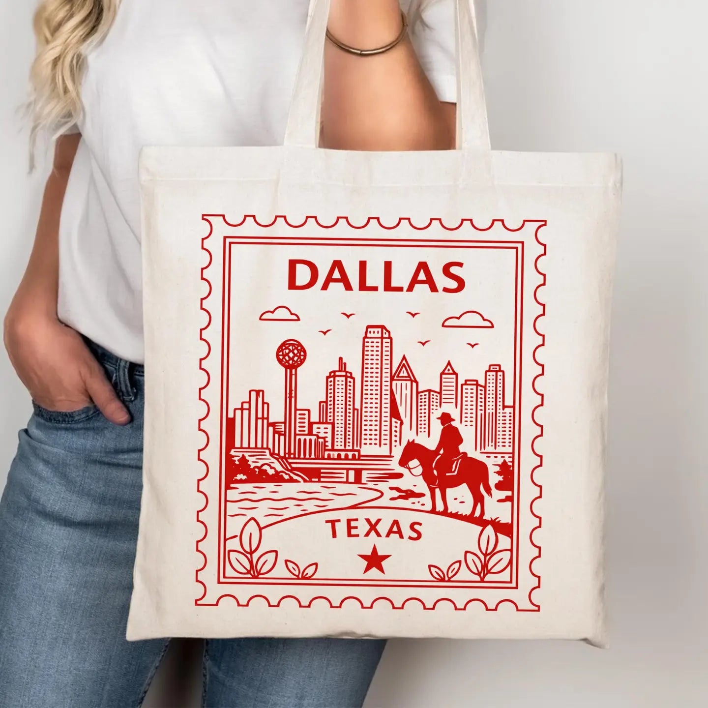 Tote bag with 'Dallas, Texas' design held by a person