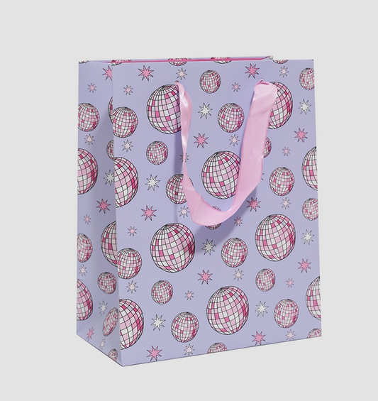Gift bag with disco ball pattern on a light purple background