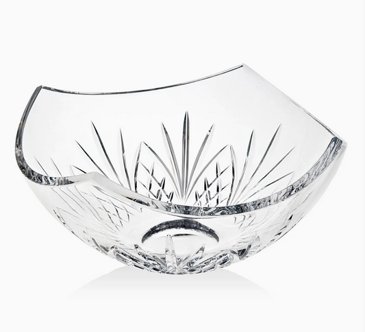 Clear glass bowl with cut design on a white background