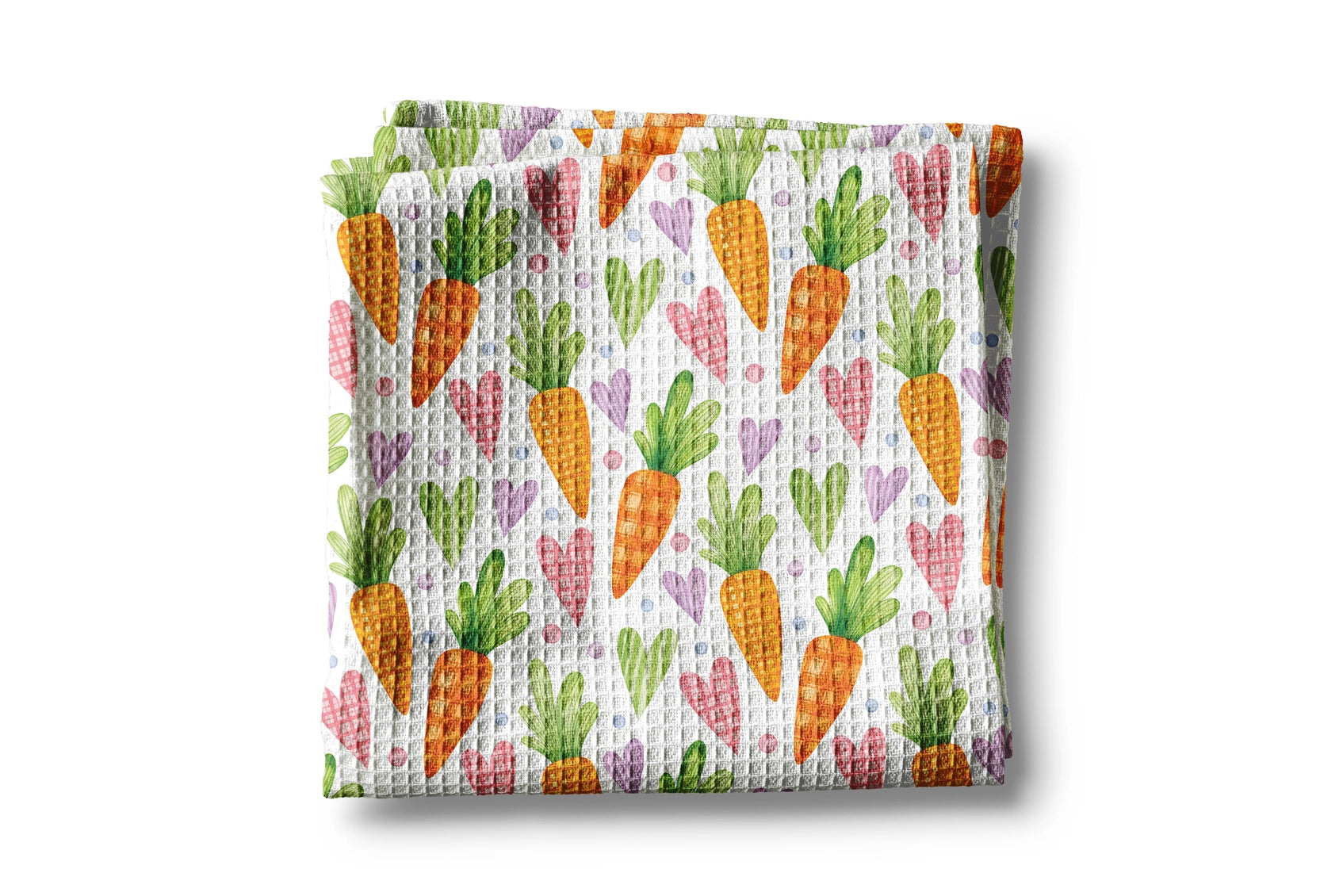 Waffle texture kitchen towel with colorful carrot pattern on a white background