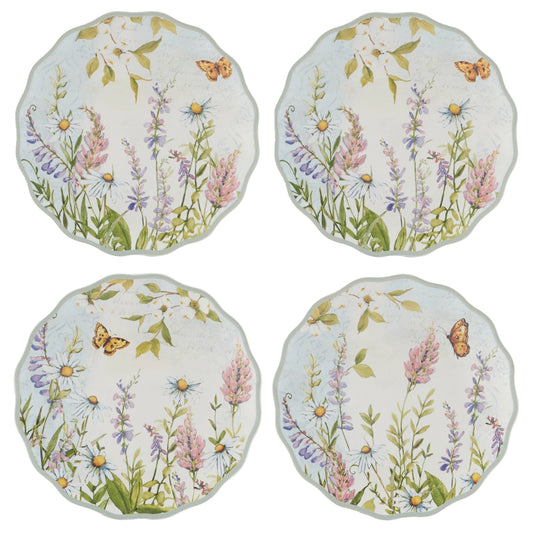 Set of four round cushions with floral and butterfly design on a white background