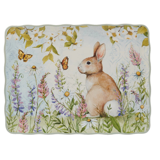 Decorative dish with a rabbit and floral design on a white background