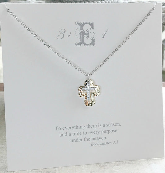 Necklace with a cross pendant on a card with text