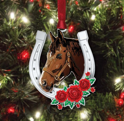 Decorative Christmas ornament with a horse head and horseshoe design on a tree.