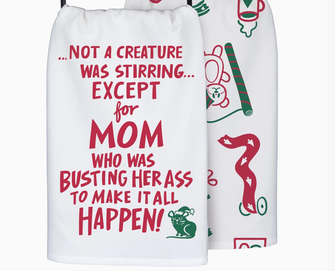 Two white towels with Christmas-themed text and graphics on a white background text 