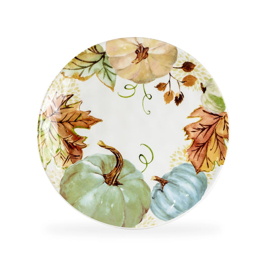 Decorative plate with autumnal design featuring pumpkins and leaves on a white background