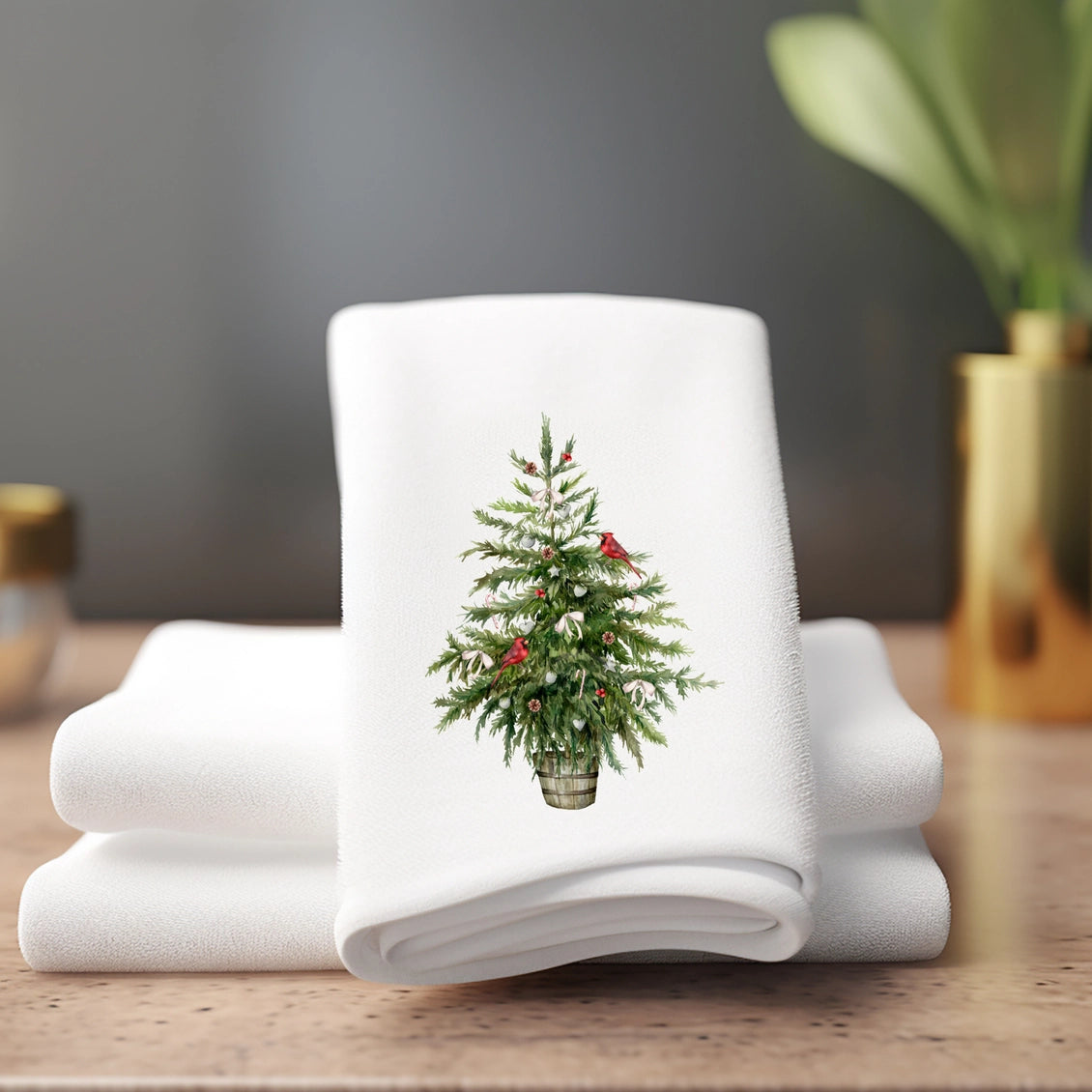 White towel with a Christmas tree design on a wooden surface