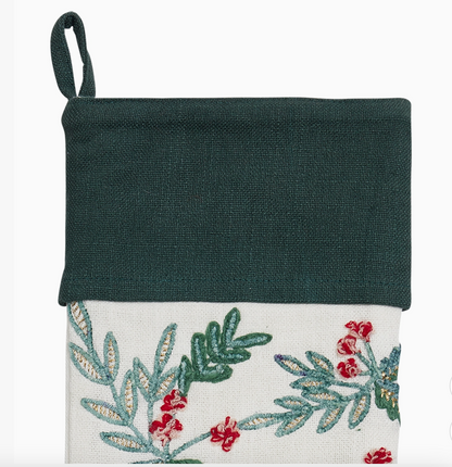 Dark green cuff and embroidered greenery detail on ivory Christmas stocking