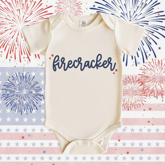 Baby onesie with 'firecracker' text on a white background