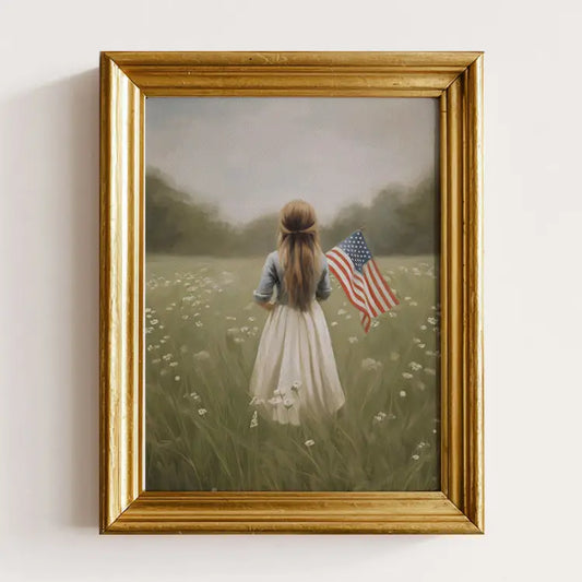 Framed artwork of a woman holding an American flag in a field.