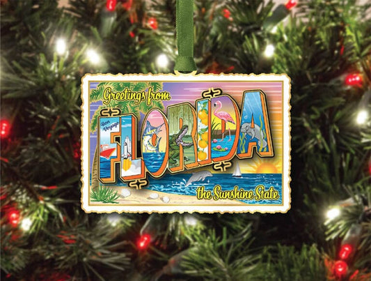Decorative Christmas ornament with 'Greetings from Florida' design on a Christmas tree.