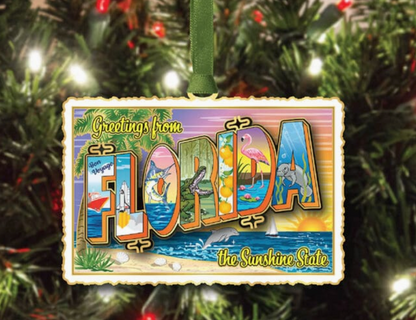 Decorative ornament with 'Greetings from Florida' text on a Christmas tree.