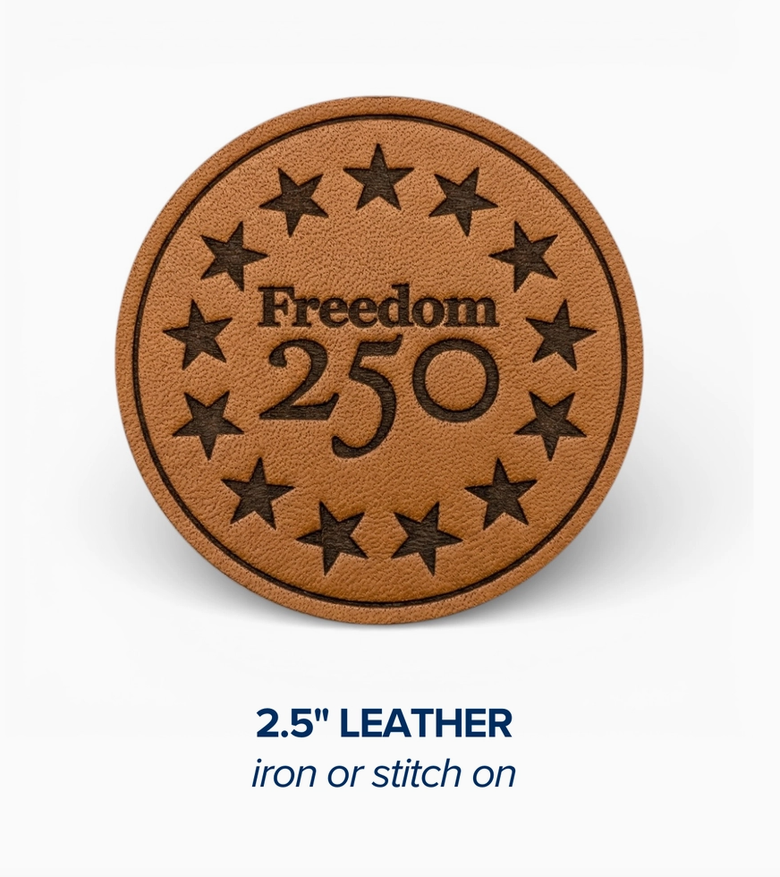 Brown leather patch with 'Freedom 250' text and star design on a white background