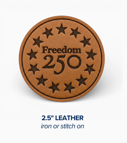 Brown leather patch with 'Freedom 250' text and star design on a white background
