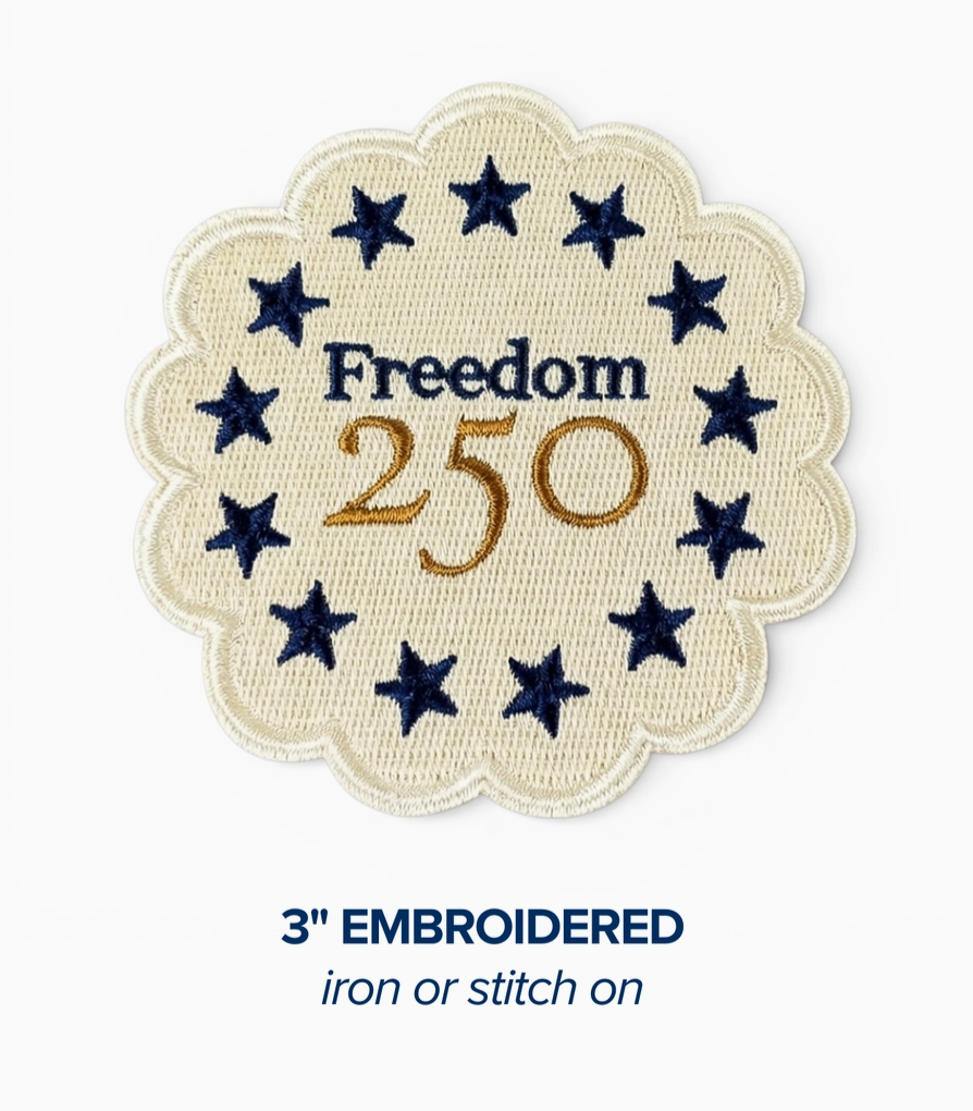 Embroidered patch with 'Freedom 250' text and star design on a white background