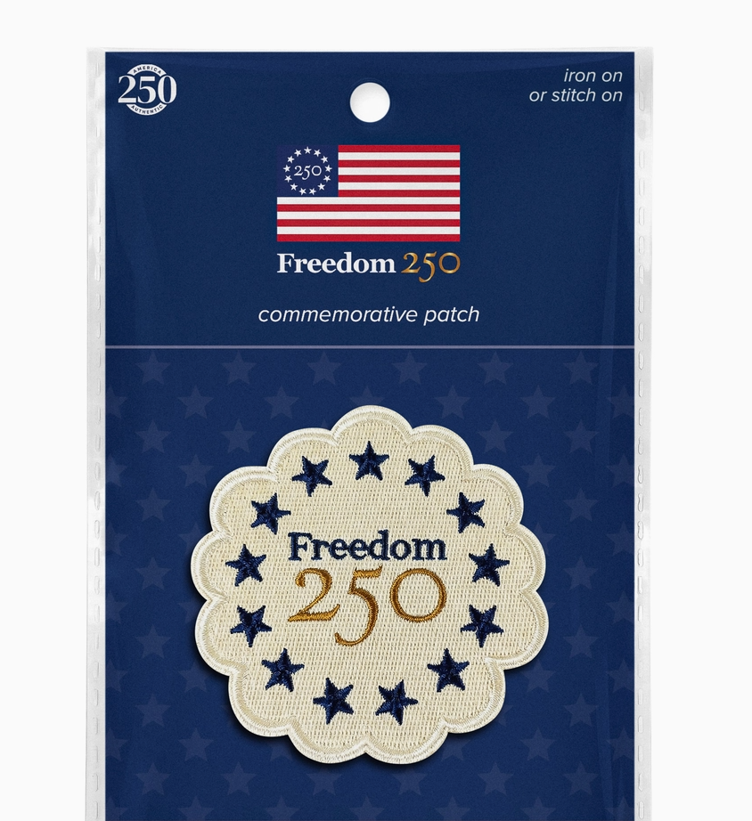 Freedom 250 commemorative patch packaging with American flag design on a blue background.
