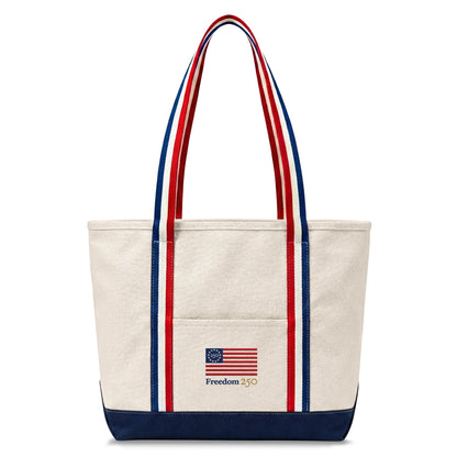 Tote bag with American flag design and 'Freedom 250' text on a white background
